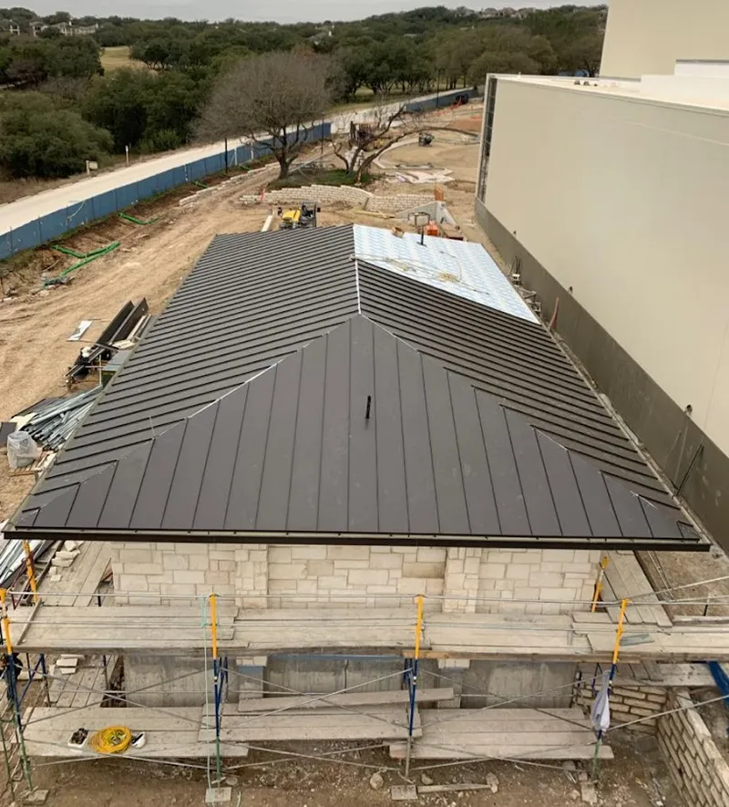 Metal roof new construction with scaffolding in Omak